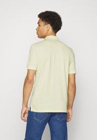 HUGO DERESO - Polo - light pastel yellow