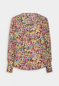 Blouse à manches longues en tissu léger, présentant un fond noir avec des motifs floraux vifs en rose, jaune et bleu. Design en V.