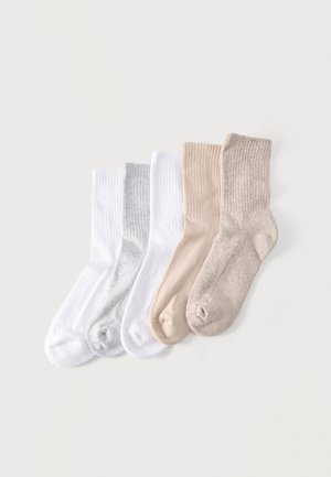 Viis paari soonikkoega meessokke valges, helehallis, beežis ja helepruunis, kõrvuti paigutatud tavalise heleda tausta peal.