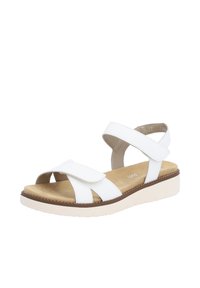 Sandale blanche avec des larges brides supérieures, fermeture Velcro réglable, semelle intérieure rembourrée et semelle en caoutchouc épaisse de couleur claire.