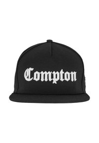 Black cap made from fabric; features prominent white "Compton" text in bold font on the front. Flat visor and structured crown.