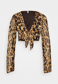 Cropped top z leopardjim vzorom s dolgimi prosojnimi rokavi. Ima globok V-izrez in sprednji detajl s pripenjanjem. Prevladujoči rjavi in črni barvi.
