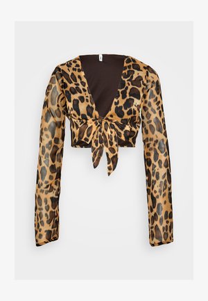 Haut court en imprimé léopard avec de longues manches transparentes. Présente un décolleté en V profond et un détail de nœud à l'avant. Couleurs principalement marron et noir.