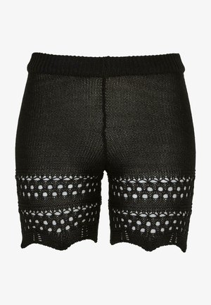 Sorte strikkede shorts med en teksturert overflate, med en bølget kant og åpen design i bunnen for ventilasjon og stil.