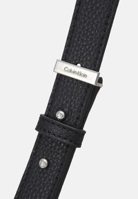 Calvin Klein CODE HOBO - Handtasche - black