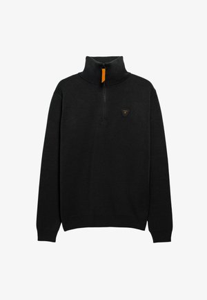 Pull en tricot noir avec un col montant et une fermeture éclair mi-longue. Présente un petit logo triangulaire sur la poitrine ainsi que des poignets et un ourlet côtelés.