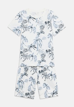 Σετ με λευκό πουκάμισο με κοντά μανίκια και σορτς με μοτίβα από μαύρα και μπλε φοινικόδεντρα και τροπικά φύλλα σε όλη την επιφάνεια.