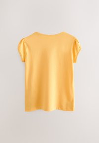 Gelbes T-Shirt mit kurzen, gepufften Ärmeln aus weichem Baumwollmaterial. Rundhalsausschnitt und gerader Saum ohne Muster oder Verzierungen.