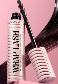 Vaaleanpunainen putkimaali, jossa on uurrettu muotoilu ja musta harja. Teksti kuuluu "WRAP LASH - MEGA EXTENSION & VOLUME TUBING MASCARA."