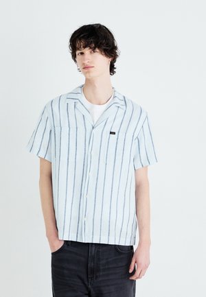 Light blue short-sleeve shirt with vertical dark stripes, two front pockets, and a collar. Made of a soft, lightweight fabric.