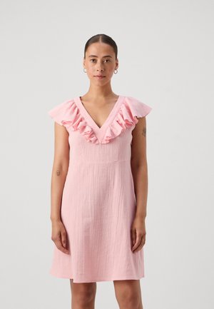 Pink dress with a textured fabric, V-neckline, and ruffled cap sleeves. The dress has a fitted bodice and flows gently to mid-thigh.