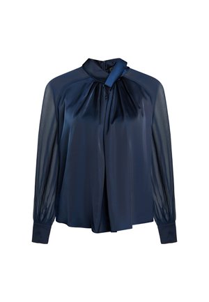 Navy blue blouse with a high neck and tie detail. Made from smooth fabric with sheer long sleeves and a slightly loose fit.