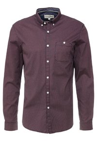 Camicia a maniche lunghe con bottoni in profondo bordeaux con una piccola stampa geometrica, dotata di taschino sul petto e bottoni bianchi. Tessuto dalla consistenza liscia.