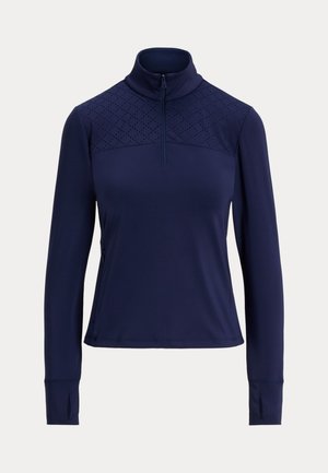 Marine quarter-zip genser med lange ermer, med en teksturert øvre panel og tommelhull. Laget av et glatt, elastisk stoff.