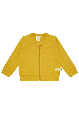 Giacca gialla con zip realizzata in tessuto testurizzato. Presenta maniche lunghe, colletto rotondo e un'etichetta laterale come dettaglio. Design semplice, colore uniforme.