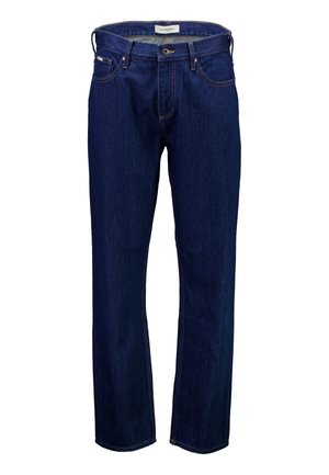 Tumesinised teksapüksid sirge lõikega, kontrastse õmblusega ja klassikalise viie taskuga disainiga. Omavad bränditud vöökohal asuvat silti.