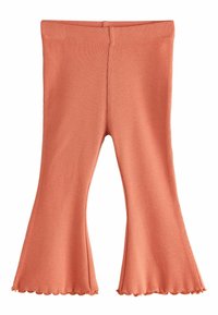 Merev bordázatú, bővülő szárú nadrág, puha őszibarack színben, hullámos szegély, rugalmas derékrész, combnál testhez simuló, alul széles bővülés.