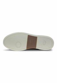 White rubber shoe sole with textured patterns, featuring a brown accent strip labeled "BOSS." Smooth finish and curved edges.