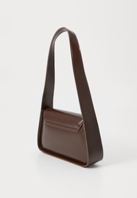 Brown leather shoulder bag with a flat, rectangular body and a wide strap. Features a flap closure and smooth texture.