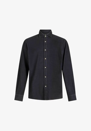 Temno modra srajca z dolgimi rokavi z ovratnikom, ki se zapenja na gumb, ter šestimi srebrnimi gumbi spredaj. Narejena iz strukturiranega blaga.