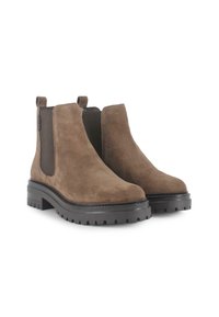 Botas de tobillo de ante marrón con paneles elásticos en los lados, una suela de goma negra gruesa y tiradores en la parte trasera para ponerlas fácilmente.