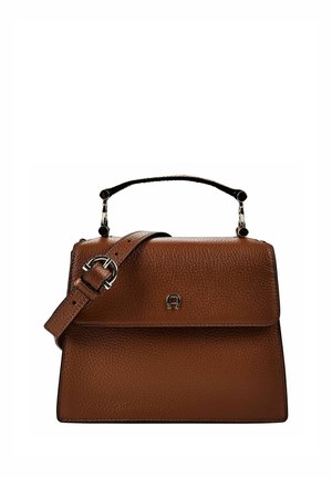 Brown textured leather handbag with top handle, adjustable buckle strap, and small metal logo on front flap.