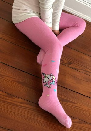 Pink tights made of soft material featuring a unicorn design on the lower leg, with small multicolored hearts scattered above.