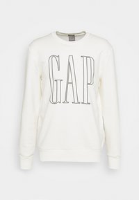 Felpa color crema con maniche lunghe e scollatura a girocollo. Presenta un grande logo nero "GAP" stampato sul davanti. Tessuto morbido.