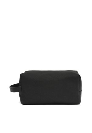 Black rectangular toiletry bag with side handle, made of fabric, shown against a white background.