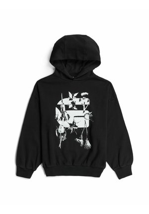 Sweat à capuche noir avec un motif abstrait floral et géométrique blanc centré sur le devant, avec des manches longues et des poignets et un ourlet côtelés.