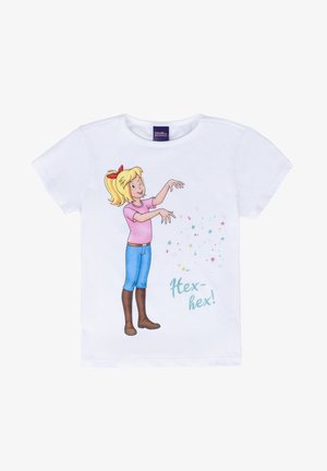 White short-sleeve T-shirt featuring a cartoon girl in a pink shirt and blue jeans, casting colorful sparkles with the text "Hex-hex!"