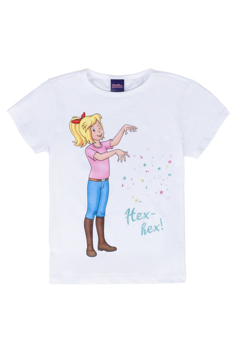 T-shirt bianco a maniche corte con una ragazza in stile cartone animato che indossa una maglietta rosa e jeans blu, mentre lancia scintille colorate con il testo "Hex-hex!"