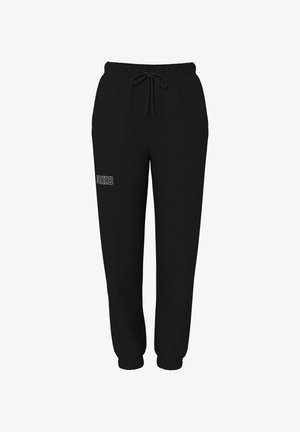 Svarta sweatpants av mjukt tyg, med elastisk midja och dragsko, elastiska muddar samt en vit "SOHO"-tryck på framsidan.