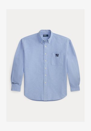 Világoskék, hosszú ujjú, gombos ing mellzsebbel, melyen sötétkék NY logó és aláírás hímzés található a bal mandzsettán.