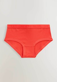Slip di cotone rosso con ampia fascia elastica caratterizzata da un logo impresso "NEXT". Texture liscia e forma rettangolare classica.