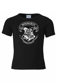 Black short-sleeve t-shirt with a white Hogwarts crest featuring an "H" and four house animal symbols. Cotton fabric, standard fit.
