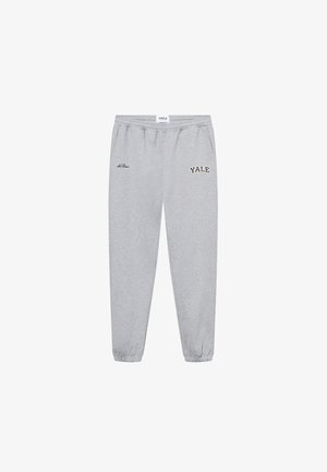 Graue Sweatpants aus Baumwollmischung, mit elastischem Bund, Seitentaschen und gesticktem "YALE"-Logo in Schwarz am linken Bein.