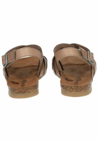 Brown leren sandalen met een kurken zool, verstelbare band en een kruisontwerp. Voorzien van een lichtjes gestructureerde voetbed voor comfort.