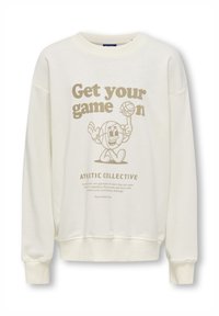 Felpa color crema con scollatura rotonda, grafica stampata di un personaggio di basket sorridente e testo "Metti in gioco il tuo talento" in beige.