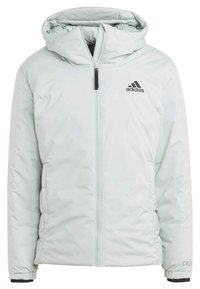 Lichtgrijze gewatteerde jas met een rits aan de voorkant en een verstelbare capuchon. Bevat zwarte accenten, waaronder het Adidas-logo en de manchetten.