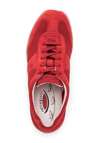 Red sneaker featuring a suede and mesh upper, round toe, flat laces, and a cushioned insole with a simple boat pattern.