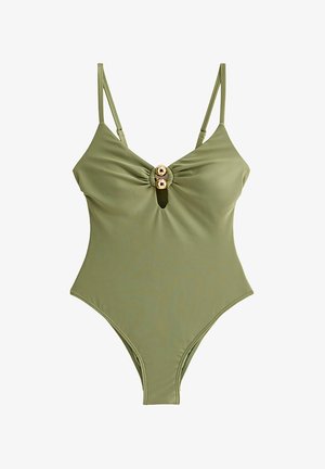Maillot de bain une pièce vert olive avec fines bretelles réglables, une petite ouverture en forme de goutte à l'avant, et deux anneaux décoratifs dorés au niveau de la poitrine.