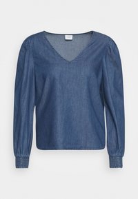 Camicia di denim con scollo a V, maniche lunghe a sbuffo, polsini elasticizzati, di color blu scuro. Texture liscia con una leggera lucentezza e cuciture minime.