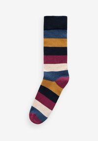 Calcetín de algodón multicolor con franjas alternas en navy, verde azulado, mostaza, burdeos, rosa y crema. Presenta un puño acanalado y puntera reforzada.