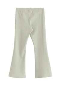 Lys grønne ribbede flared leggings med en glat tekstur. Har en elastisk talje og en ren sømfinish i bunden.