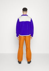 The North Face Flisinis džemperis - lapis blue/sandstone/cone orange