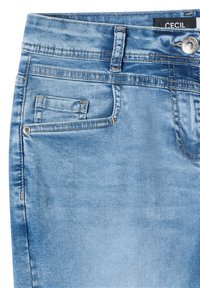 Light blue faded denim jeans section showing front pocket, coin pocket, belt loop, metal button, and black label with "CECIL" brand.