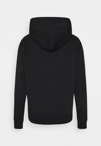 Černá mikina s kapucí se seamless jemnou texturou, připojenou kapucí a elastickými manžetami. Pohled zezadu ukazuje jednoduchý, nenápadný design.