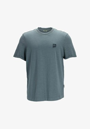 T-shirt gris à manches courtes en tissu doux, présentant un col rond et un petit écusson de logo sombre sur le côté gauche de la poitrine.