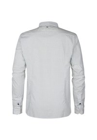 Camicia bianca a maniche lunghe con un piccolo motivo a pois blu navy, colletto con bottoni a pressione e bottoni scuri a contrasto sui polsini. Tessuto dalla texture liscia.
